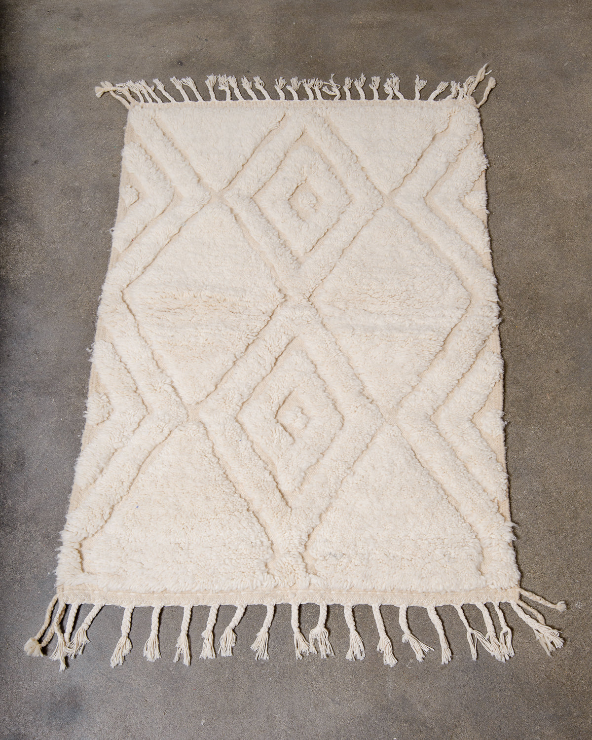 Modern, designer, handcrafted Berber rug from Morocco. Beniourain carpet with beautiful colours and patterns and fluffy wool texture.